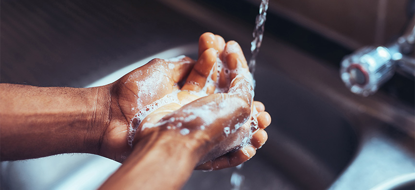 Washing hands in sink